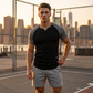 T-shirt de sport pour homme à manches raglan et col fendu en V